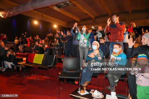 Supporters watch together the men's mass start speed skating event at the Beijing 2022 Winter Olympics in Beijing, China, Saturday 19 February 2022,...