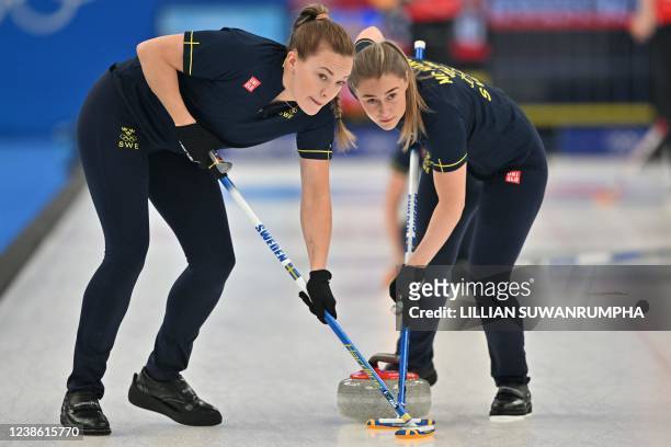 Sweden's Agnes Knochenhauer and Sweden's Sara McManus compete during the women's bronze medal game of the Beijing 2022 Winter Olympic Games curling...
