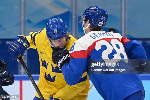 Jacob De La Rose of Sweden and Martin Gernat of Slovakia fight at the Broncemadel Game between Sweden and Slovakia during the Beijing 2022 Winter...