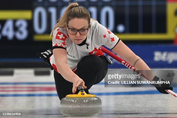 Switzerland's Alina Paetz plays the stone during the women's bronze medal game of the Beijing 2022 Winter Olympic Games curling competition between...