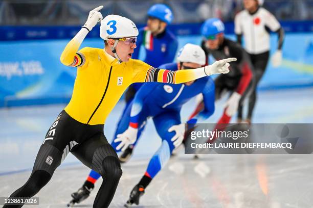 Belgian speed skater Bart Swings celebrates as he crosses the finish line to win the final of the men's mass start speed skating event at the Beijing...