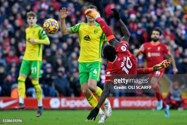 Liverpool's Senegalese striker Sadio Mane scores their first goal with this acrobatic shot during the English Premier League football match between...