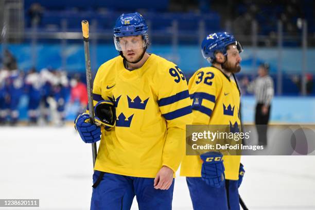 Jacob De La Rose of Sweden and Lukas Bengtsson of Sweden looks dejected after the Broncemadel Game between Sweden and Slovakia during the Beijing...