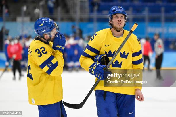 Lukas Bengtsson of Sweden and Jacob De La Rose of Sweden looks dejected after the Broncemadel Game between Sweden and Slovakia during the Beijing...