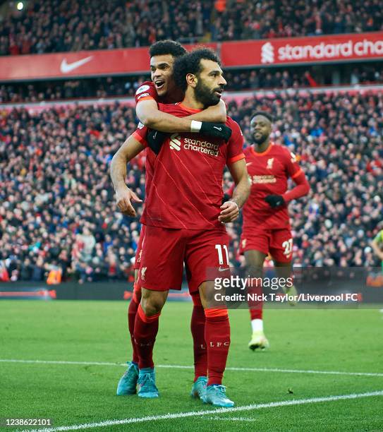 Mohamed Salah of Liverpool celebrates his goal with Luis Diaz during the Premier League match between Liverpool and Norwich City at Anfield on...