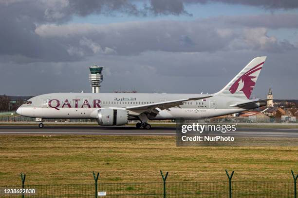 Qatar Airways Boeing 787-8 Dreamliner aircraft as seen on final approach flying, landing and taxiing at the Belgian capital, Brussels Airport...