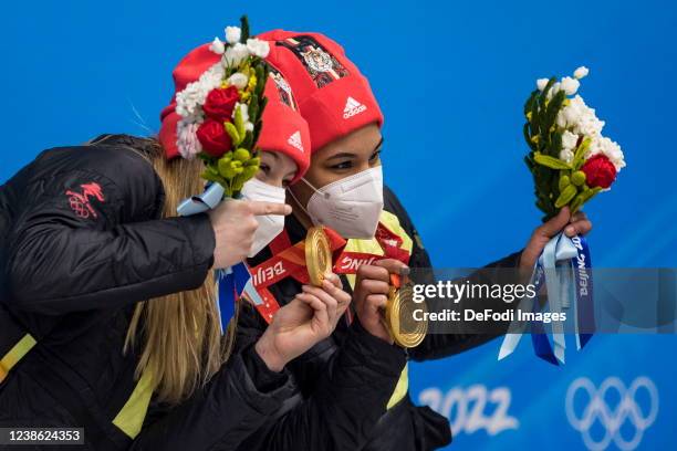 Mariama Jamanka of Germany, Alexandra Burghardt of Germany with the olympic gold medal during the medal ceremony for the 2 women's bobsleigh during...