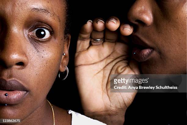 woman telling herself secret in ear - intim piercing bildbanksfoton och bilder