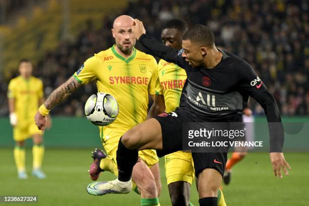 Paris Saint-Germain's French forward Kylian Mbappe controls the ball during the French L1 football match between FC Nantes and Paris-Saint Germain at...