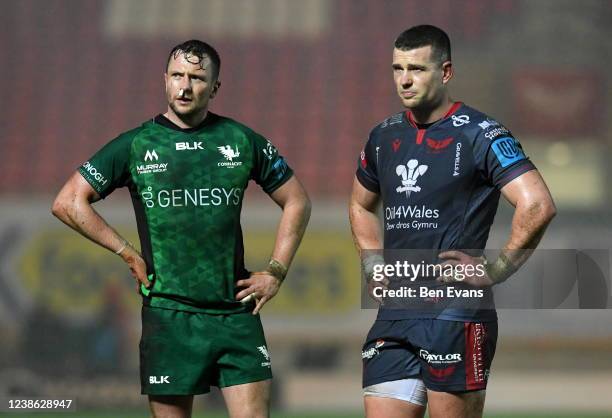 Wales , United Kingdom - 19 February 2022; Jack Carty of Connacht and Scott Williams of Scarlets during the United Rugby Championship match between...