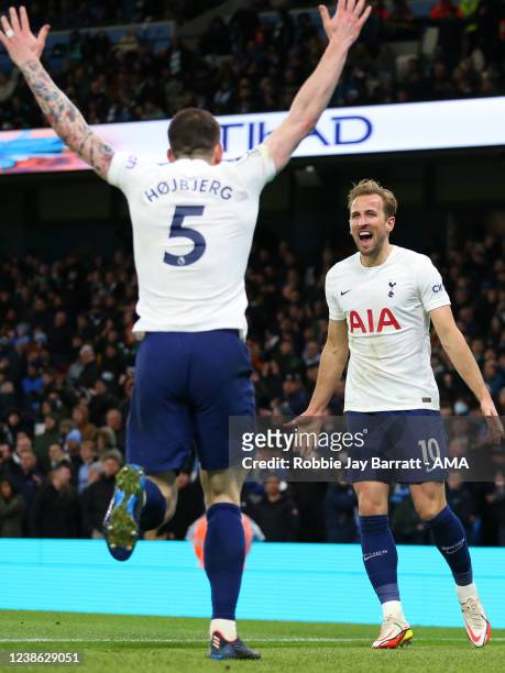 Harry Kane of Tottenham Hotspur celebrates after scoring a goal to make it 2-3 during the Premier League match between Manchester City and Tottenham...