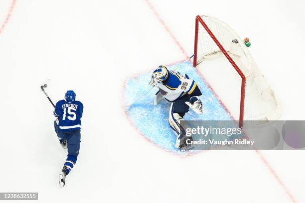 Alexander Kerfoot of the Toronto Maple Leafs plays the puck infant of Ville Husso of the St. Louis Blues during the first period at the Scotiabank...