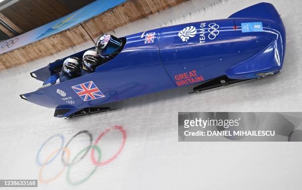 Britain's Brad Hall, Taylor Lawrence, Nick Gleeson and Greg Cackett compete in the 4-man bobsleigh event at the Yanqing National Sliding Centre...