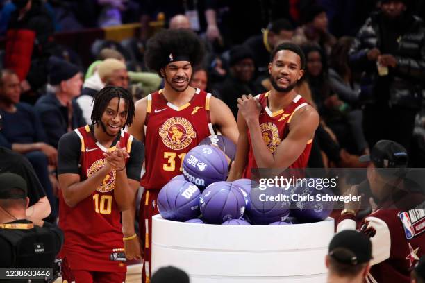 Evan Mobley of the Cleveland Cavaliers, Darius Garland of the Cleveland Cavaliers, and Jarrett Allen of the Cleveland Cavaliers participate in the...