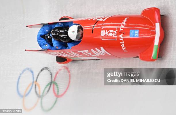 Italy's Mattia Variola, Robert Mircea, Alex Pagnini and Jose Delmas Obou compete in the 4-man bobsleigh event at the Yanqing National Sliding Centre...