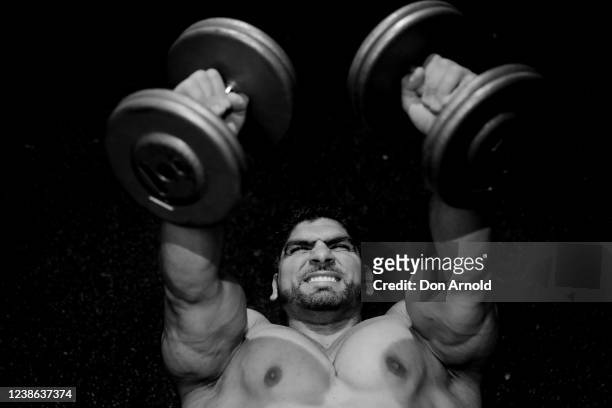 Chris Kavvalos performs a dumbbell press on May 24, 2020 in Sydney, Australia. IFFBB body builder Chris Kavvalos has continued training in Sydney...