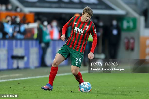Lasse Guenther of FC Augsburg controls the ball during the Bundesliga match between FC Augsburg and Sport-Club Freiburg at WWK-Arena on February 19,...