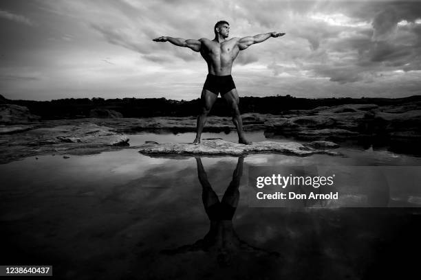 Chris Kavvalos poses during an early morning photo shoot at Little Bay on May 31, 2020 in Sydney, Australia. IFBB body builder Chris Kavvalos has...