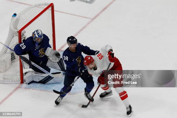 Juuso Hietanen of Team Finland and Anton Slepyshev of Team ROC in action during the Men's Ice Hockey Gold Medal match between Team Finland and Team...