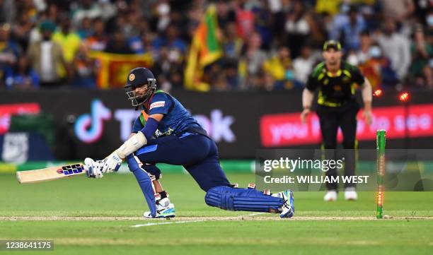 Sri Lanka batsman Dasun Shanaka is bowled by Australia's Kane Richardson during the fifth Twenty20 international cricket match at the Melbourne...