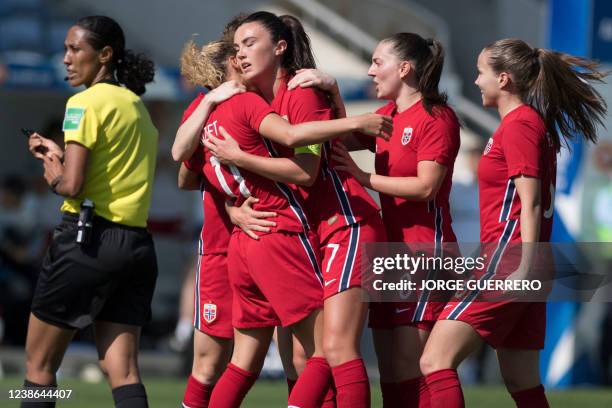 Norway's forward Celin Bizet Ildhusoy celebrates with teammates after scoring a goal during the Algarve Cup international women's football match...
