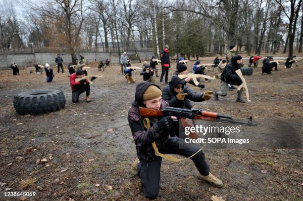 Ukrainians attend an open military training for civilians range as part of the "Don't panic! Get ready! " in Kyiv amid the threat of Russian invasion.