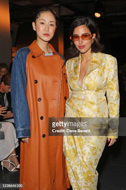 Betty Bachz and Bettina Looney attend the Yuhan Wang show during London Fashion Week February 2022 at the BFC NEWGEN Show Space on February 20, 2022...