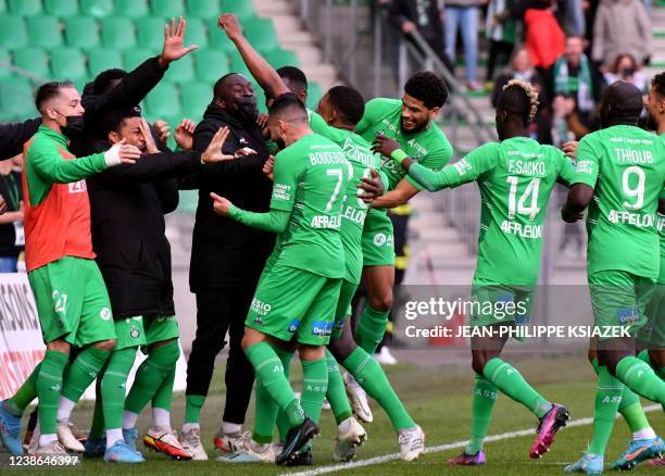 Saint-Etienne's French Algerian midfielder Ryad Boudebouz celebrates with teammates after scoring a goal during the French L1 football match between...