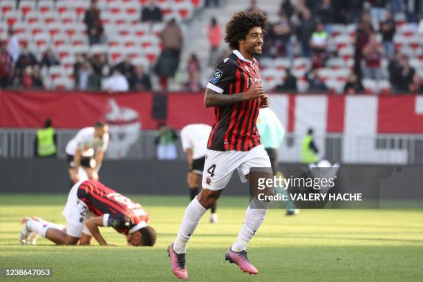 Nice's Brazilian defender Dante celebrates at the end of the French L1 football match between OGC Nice and Angers at "Allianz Riviera" stadium in...