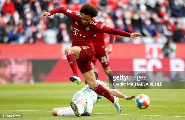 Bayern Munich's German midfielder Leroy Sane and Greuther Fuerth's Dutch defender Nick Viergever vie for the ball during the German first division...