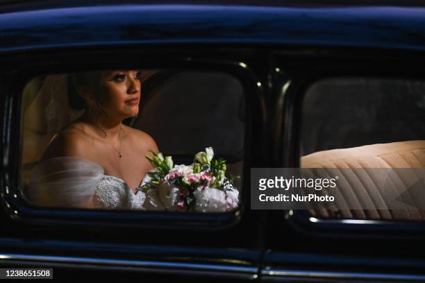 Scene with a Bride arriving in a vintage car outside a church ahead of her wedding, seen in Merida city center.On Saturday, February 19 in Merida,...