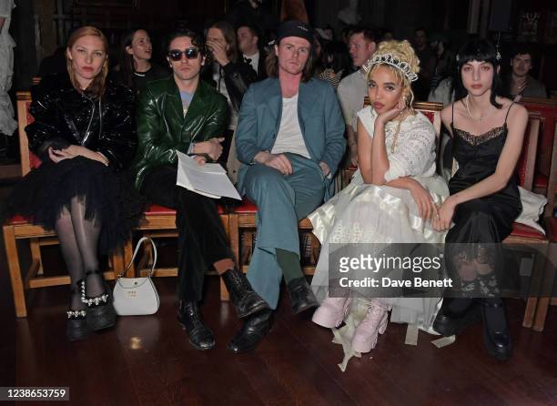 Josephine de La Baume, guest, Conor Curley, FKA Twigs and Devon Ross attend the Simone Rocha show during London Fashion Week February 2022 at The...