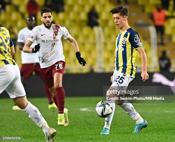 Arda Guler of Fenerbahce and Yassine Benzia of Hatayspor in action during the Turkish Super League football match between Fenerbahce and Hatayspor at...