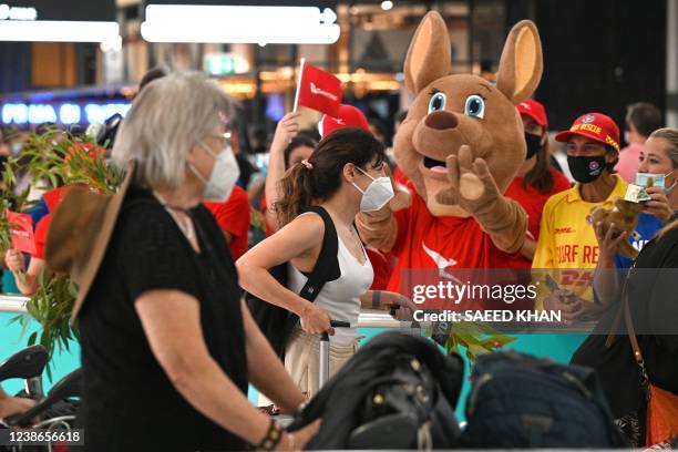 Mascot welcomes passengers upon arrival at the Sydney International Airport on February 21 as Australia reopened its borders for fully vaccinated...