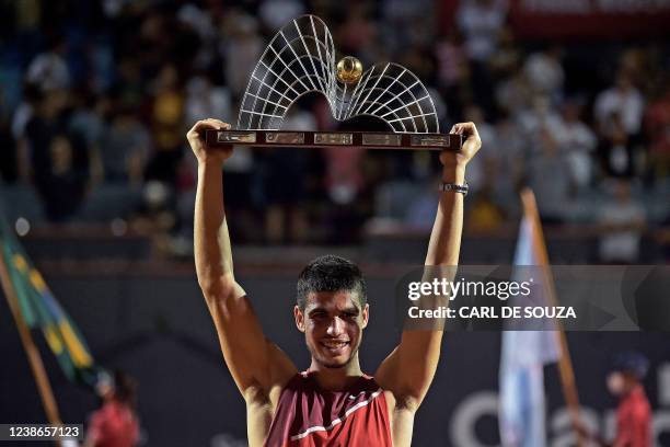 Spain's Carlos Alcaraz celebrates with the trophy after defeating Argentina's Diego Schwartzman in the ATP World Tour Rio Open 2022 final tennis...