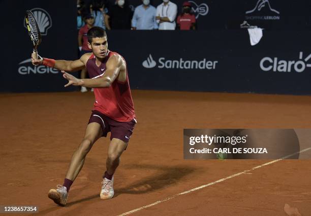 Spain's Carlos Alcaraz returns the ball to Argentina's Diego Schwartzman during their ATP World Tour Rio Open 2022 final tennis match at the Jockey...