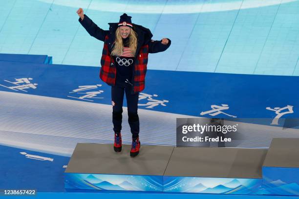 Silver medallist Jessie Diggins of Team United States celebrates during the Women's 30km Mass Start medal ceremony during the Beijing 2022 Winter...
