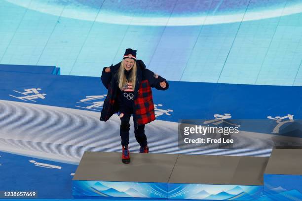 Silver medallist Jessie Diggins of Team United States celebrates during the Women's 30km Mass Start medal ceremony during the Beijing 2022 Winter...