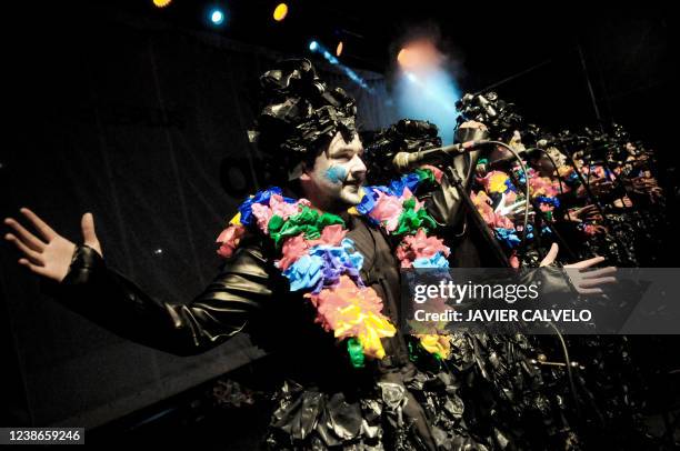 Members of the "Dona Bastarda" murga perform during carnival in Montevideo on February 16, 2022. - Murga is a form of popular musical theatre that...