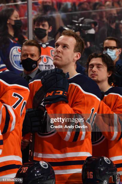 Tyler Benson of the Edmonton Oilers stands for the singing of the national anthem prior to the game against the Minnesota Wild on February 20, 2022...