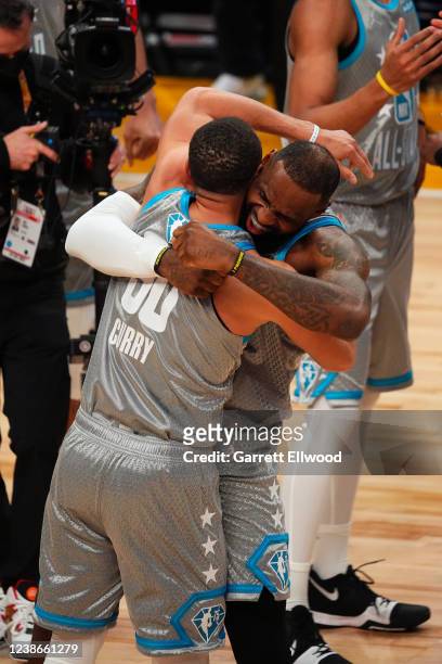 LeBron James and Stephen Curry of Team LeBron embrace and celebrate after winning 2022 NBA All-Star Game as part of 2022 NBA All Star Weekend on...