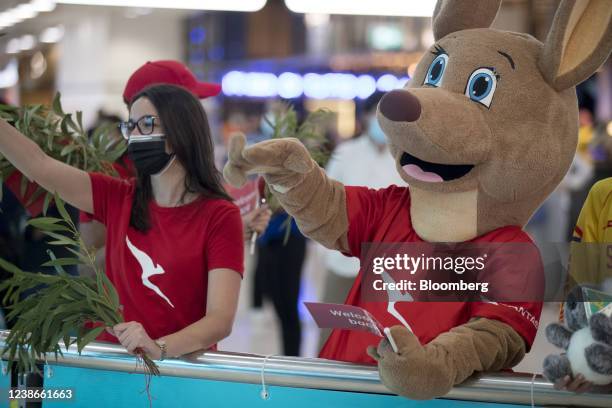 Qantas Airways Ltd. Mascot The Flying Kangaroo, right, welcomes travelers at Sydney Airport in Sydney, Australia, on Monday, Feb. 21, 2022. Australia...