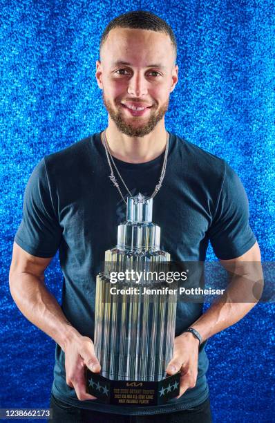 Stephen Curry poses for a portrait with the KIA Kobe Bryant All Star MVP Trophy during the 2022 NBA All-Star Game as part of 2022 NBA All Star...