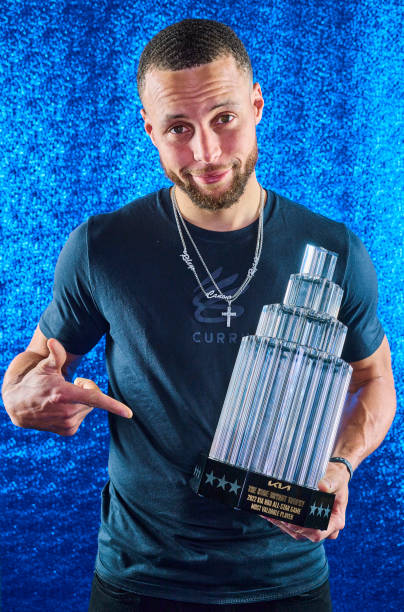 Stephen Curry poses for a portrait with the KIA Kobe Bryant All Star MVP Trophy during the 2022 NBA All-Star Game as part of 2022 NBA All Star...