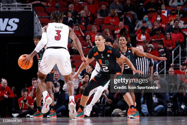 Miami Hurricanes guard Isaiah Wong defends against Louisville Cardinals guard El Ellis during a college basketball game on Feb. 16, 2022 at KFC Yum!...