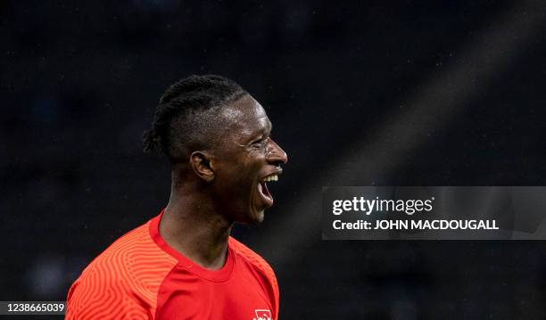 Leipzig's Malian midfielder Amadou Haidara celebrates after scoring the 5-1 goal during the German first division Bundesliga football match between...