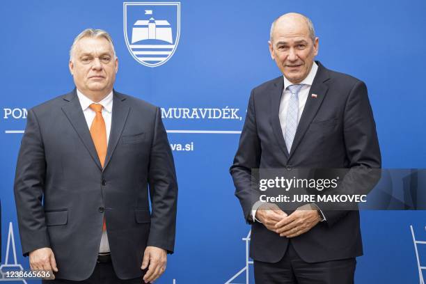 Slovenia's Prime Minister Janez Jansa poses with his Hungary's counterpart Viktor Orban prior to the start of their meeting in Lendava, a city with a...