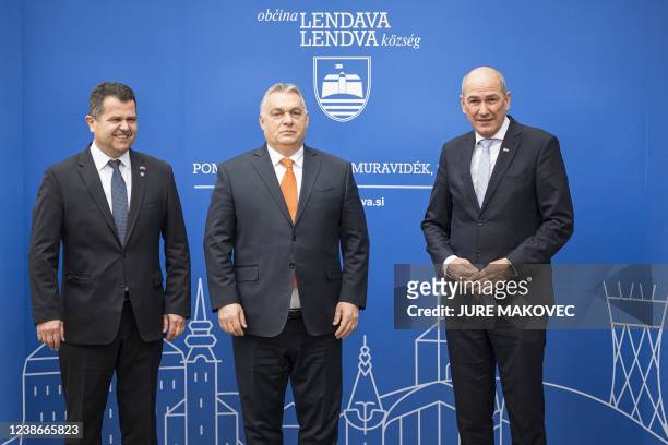 Slovenia's Prime Minister Janez Jansa poses with his Hungary's counterpart Viktor Orban and Janez Magyar , Mayor of Lendava, prior to the start of a...