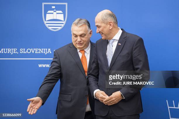 Slovenia's Prime Minister Janez Jansa welcomes his Hungary's counterpart Viktor Orban prior to the start of their meeting in Lendava, a city with a...