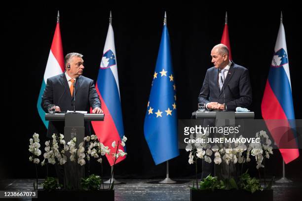 Slovenia's Prime Minister Janez Jansa looks at his Hungary's counterpart Viktor Orban as they hold a joint-press conference after a meeting in...